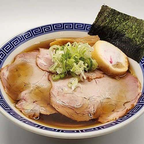 クーポン提示で、注文のラーメンが味玉＆鶏チャーシューを追加した特製ラーメンに！